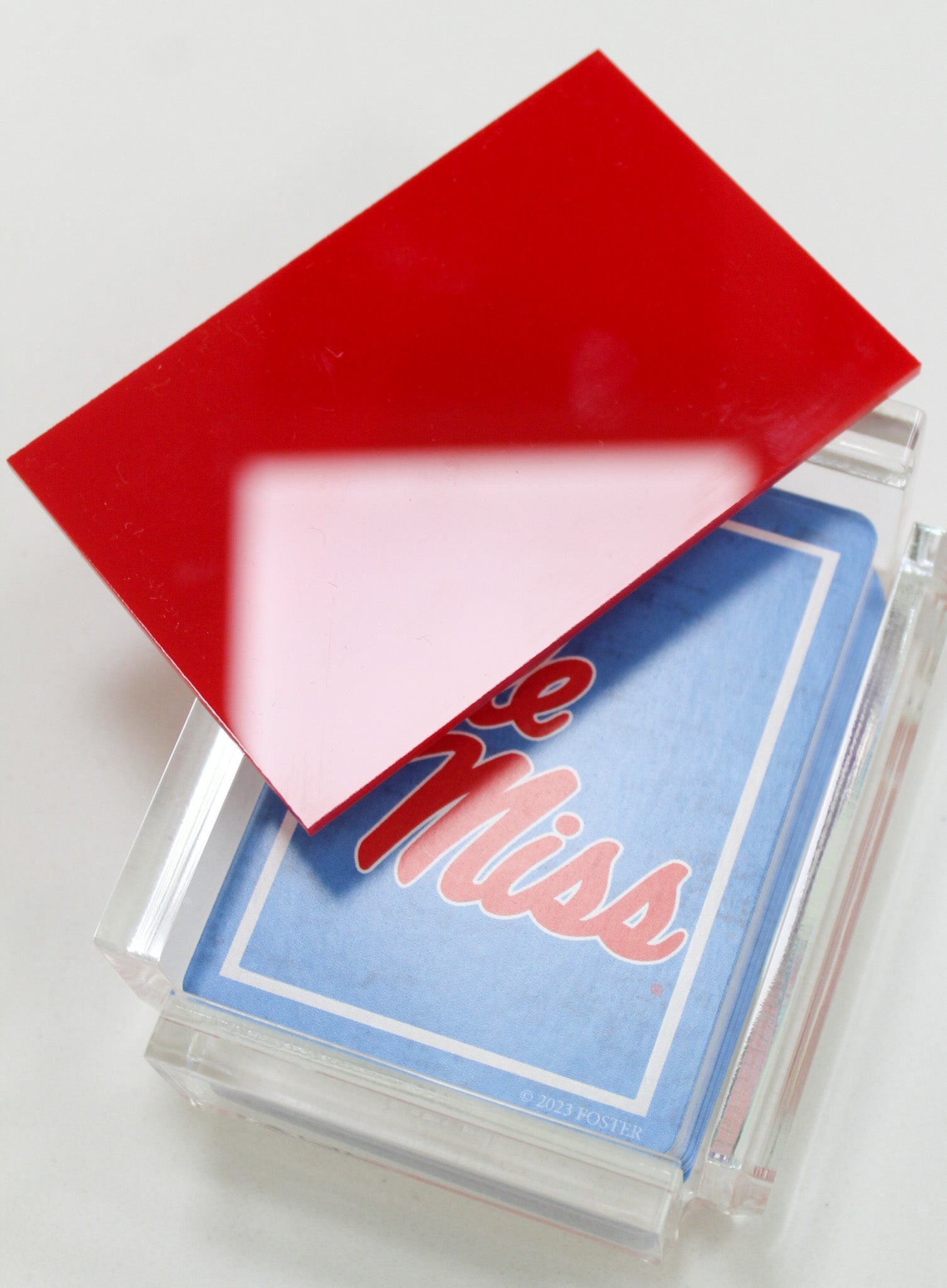 red acrylic playing card case from FOSTER with Ole Miss playing cards