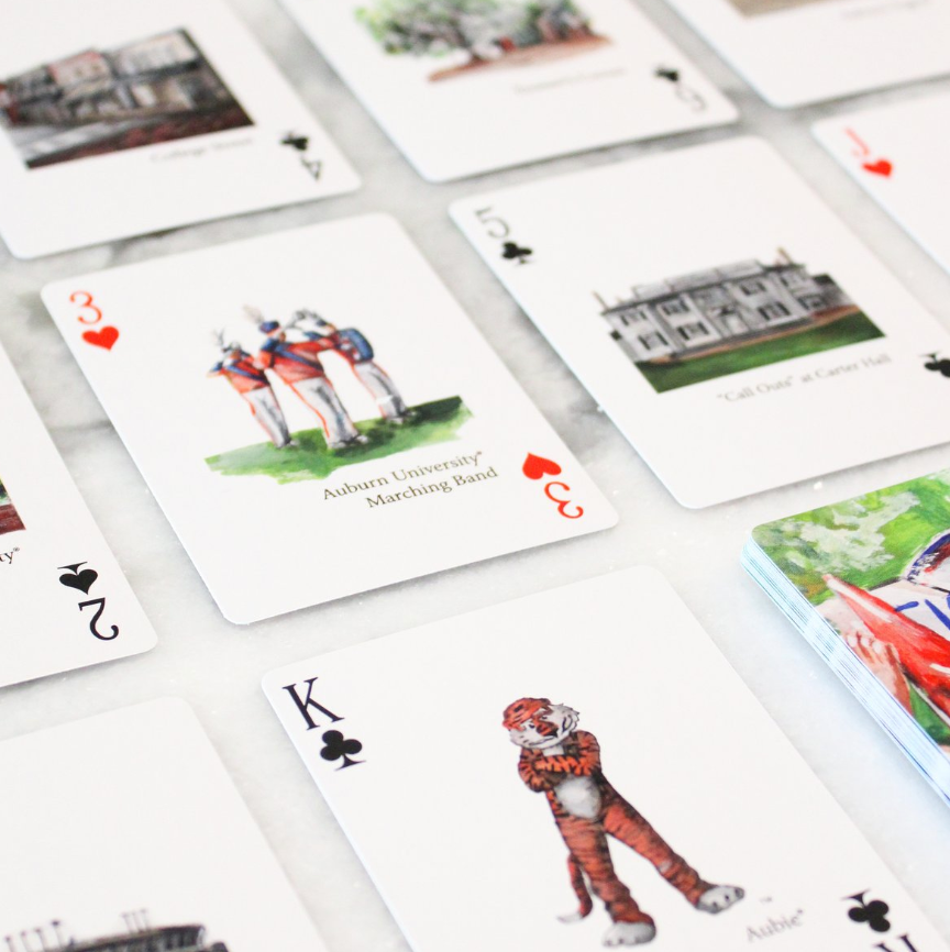 Auburn deck of cards by FOSTER. displays 16 paintings of Auburn traditions and icons.